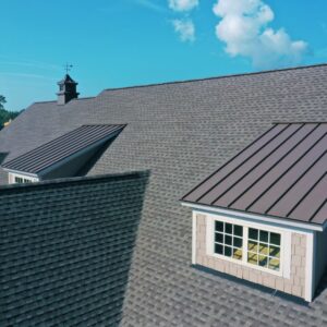 Aerial view of a residential home featuring architectural asphalt shingles and metal roofing accents. Ryan Construction Systems offers premium roof installations and mixed-material roofing solutions in Kansas City, Parkville, Liberty, and surrounding areas. Trusted roofing contractor near you for stylish, durable, and energy-efficient roofing upgrades.