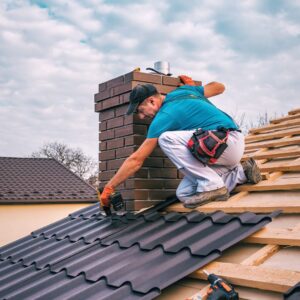 Ryan Construction Systems, Inc. employee works on a shingle installation