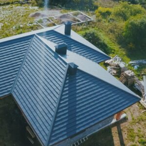 Aerial photo of roof with construction supplies to the left