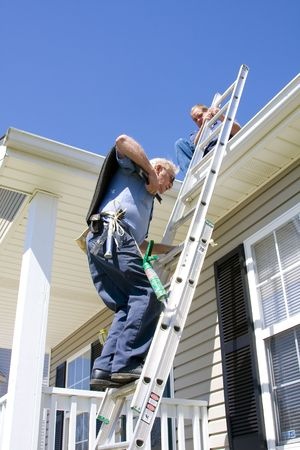photo of roofer on a ladder, repairing roofing system