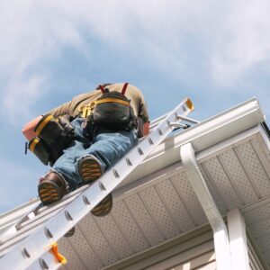 Professional roofer performing roof inspection on home after storm damage – trusted Kansas City roofing contractor services in Parkville, Riverside, and Platte City.
